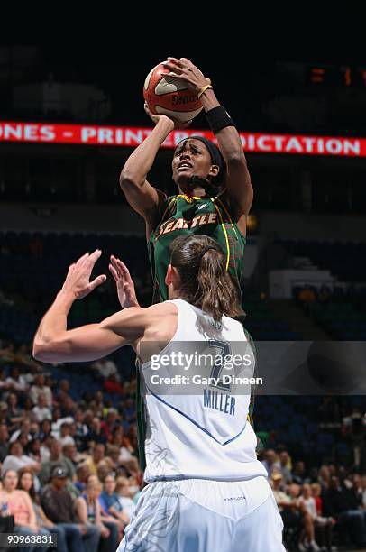 Swin Cash of the Seattle Storm takes a jump shot against Kelly Miller of the Minnesota Lynx during the game on September 5, 2009 at Target Center in...