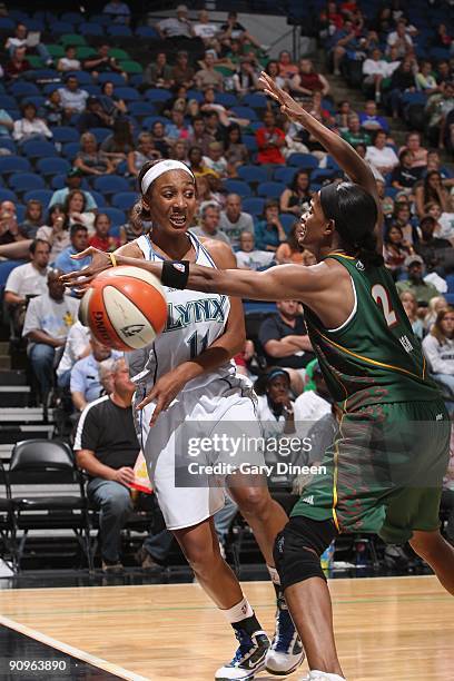 Candice Wiggins of the Minnesota Lynx looks to pass against Swin Cash of the Seattle Storm during the game on September 5, 2009 at Target Center in...