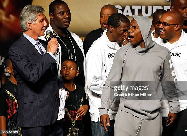 Boxing announcer Michael Buffer, Koraun Mayweather, boxer Floyd Mayweather Jr. And his advisor Leonard Ellerbe attend the official weigh-in for...