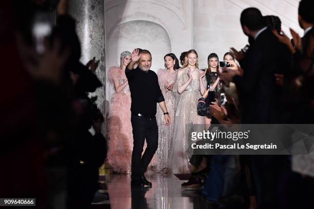 Elie Saab aknwoledges applause on the runway during the Elie Saab Spring Summer 2018 show as part of Paris Fashion Week on January 24, 2018 in Paris,...