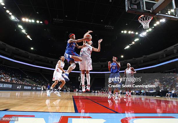 Deanna Nolan of the Detroit Shock drives to the basket during Game Two of the WNBA Eastern Conference Semifinals against Jennifer Lacy of the Atlanta...