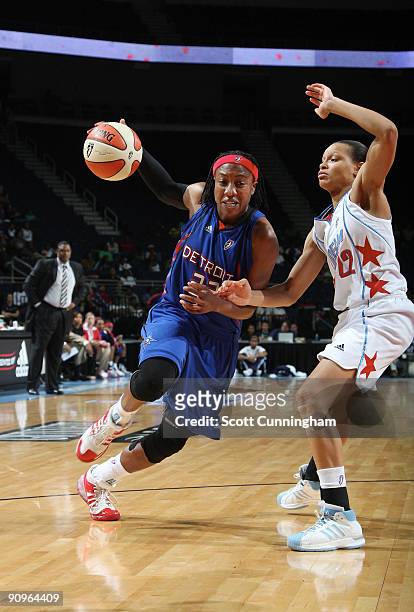 Alexis Hornbuckle of the Detroit Shock drives during Game Two of the WNBA Eastern Conference Semifinals against Armintie Price of the Atlanta Dream...