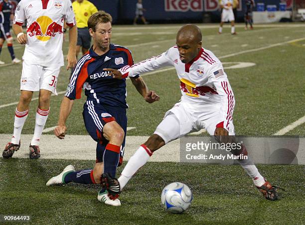 Dane Richards of the New York Red Bulls and Steve Ralston of the New England Revolution battle for a loose ball during their game at Giants Stadium...