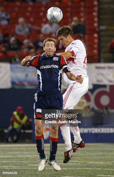 Andrew Boyens of the New York Red Bulls and Steve Ralston of the New England Revolution go up for a header during their game at Giants Stadium on...