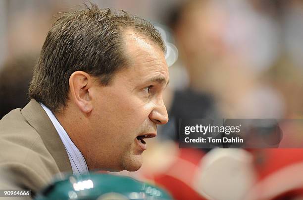 Head coach Todd Richards of the Minnesota Wild watches the game from the bench during the second period in a preseason game on September 18, 2009 at...