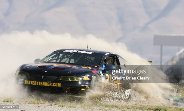 The Pontiac of Hal Prewitt and Jim Briody spins off the track during practice at Miller Motorsports Park on September 18, 2009 in Tooele, Utah.