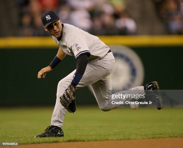 Derek Jeter of the New York Yankees attempts to field a ground ball by Franklin Gutierrez of the Seattle Mariners on September 18, 2009 at Safeco...