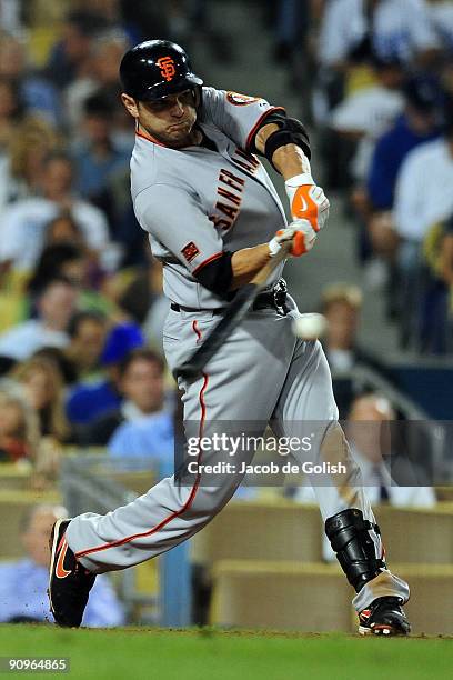 Freddy Sanchez of the San Francisco Giants hits a single in the fifth inning against the Los Angeles Dodgers at Dodger stadium on September 18, 2009...