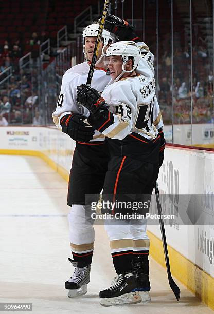Dan Sexton of the Anaheim Ducks celebrates with teammate Jassen Cullimore after Sexton scored a third-period power-play goal against the Phoenix...