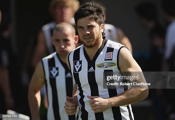 Paul Medhurst of the Magpies runs onto the ground prior to the VFL 1st Preliminary Final between North Ballarat and the Collingwood Magpies at Teac...