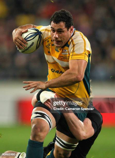 George Smith of the Wallabies is tackled during the 2009 Tri Nations series Bledisloe Cup match between the New Zealand All Blacks and the Australian...