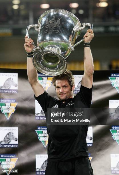 Richie McCaw of the All Blacks holds the Bledisloe cup after the 2009 Tri Nations series Bledisloe Cup match between the New Zealand All Blacks and...