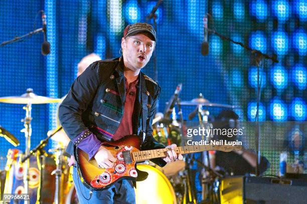 Jonny Buckland of Coldplay performs on stage at Wembley Stadium on September 18, 2009 in London, England.