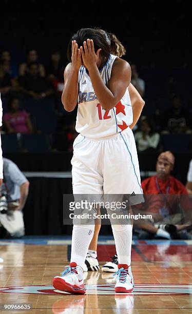 Ivory Latta of the Atlanta Dream reacts to a call during Game 2 of the WNBA Eastern Conference Semifinals against the Detroit Shock at Gwinnett Arena...