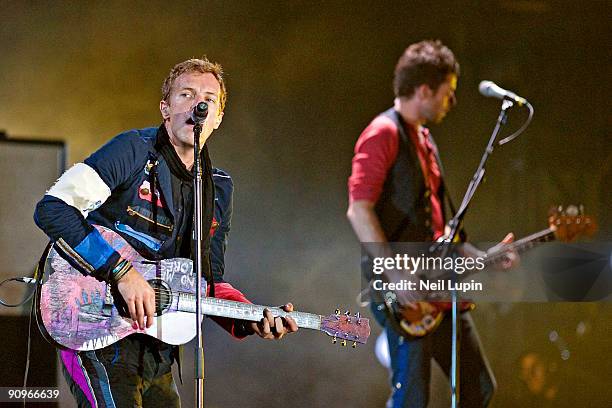Chris Martin and Guy Berryman of Coldplay perform on stage at Wembley Stadium on September 18, 2009 in London, England.