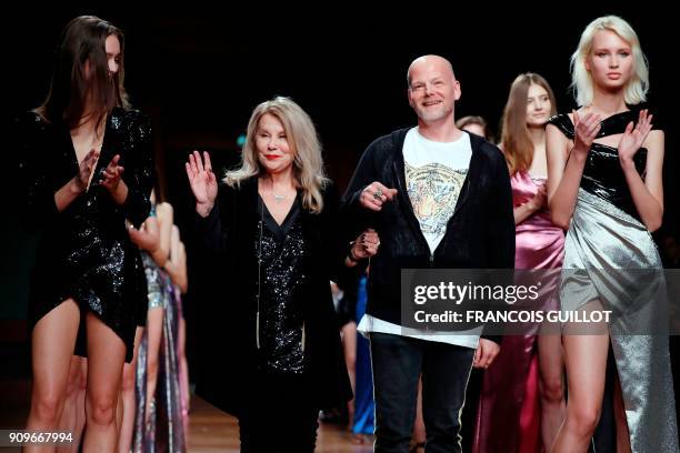 Israeli fashion designers Galia Lahav and Sharon Sever ackowledge the audience at the end of the Galia Lahav's fashion show during the 2018...