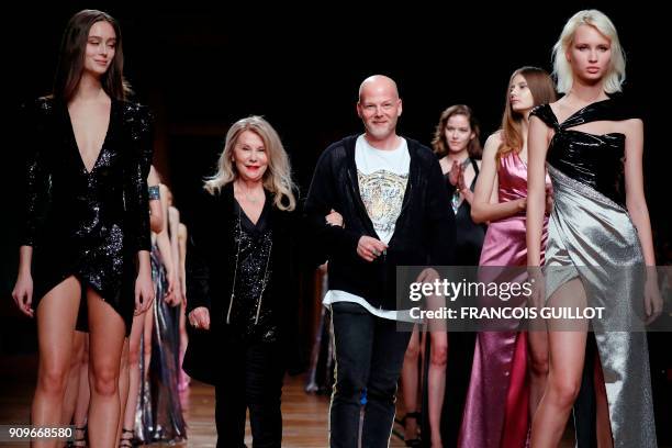 Israeli fashion designers Galia Lahav and Sharon Sever ackowledge the audience at the end of the Galia Lahav's fashion show during the 2018...