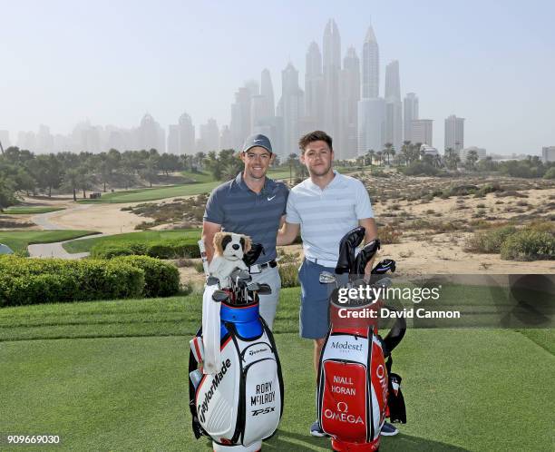 Niall Horan the musical artist poses for a picture on the eighth tee with Rory McIlroy of Northern Ireland during the pro-am as a preview for the...