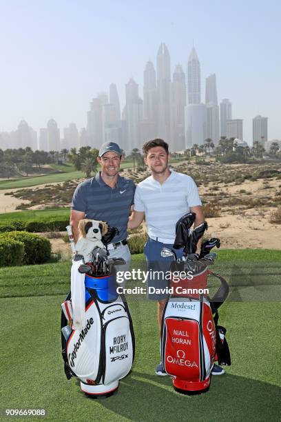 Niall Horan the musical artist poses for a picture on the eighth tee with Rory McIlroy of Northern Ireland during the pro-am as a preview for the...