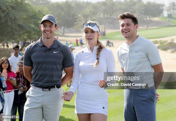 Niall Horan the music artist with Rory McIlroy of Northern Ireland and Paige Spiranac of the United States on the eighth tee during the pro-am as a...