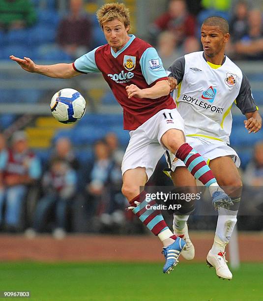 Burnley's English midfielder Wade Elliott vies with Sunderland's English forward Fraizer Campbell during the English Premier League football match...