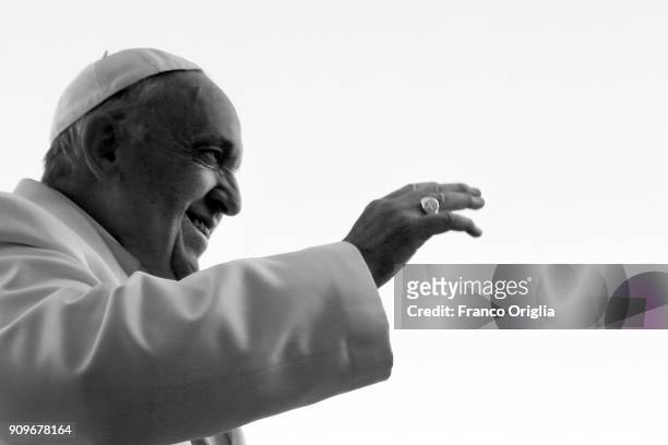 Pope Francis waves to the faithful gathered in St. Peter's Square during his weekly audience on January 24, 2018 in Vatican City, Vatican. In his...
