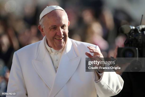 Pope Francis waves to the faithful gathered in St. Peter's Square during his weekly audience on January 24, 2018 in Vatican City, Vatican. In his...