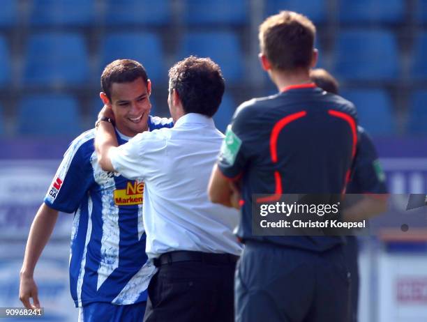 Mimoun Azaouagh of Bochum celebrates the first goal with head coach Marcel Koller of Bochum during the Bundesliga match between VfL Bochum and FSV...