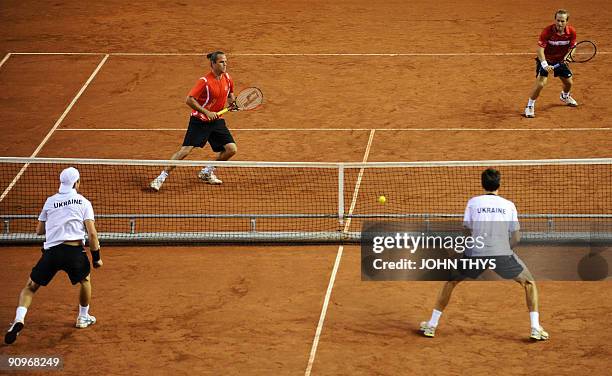 Belgian tennis players Xavier Malisse and Christophe Rochus play against Ukrainian Sergiy Bubka and Sergiy Stakhovsky during their doubles match at...