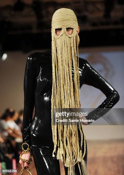 Model walks the catwalk during the Charlie Le Mindu Spring/Summer 2010 show as part of Blow Presents during London Fashion Week at the Royal Festival...