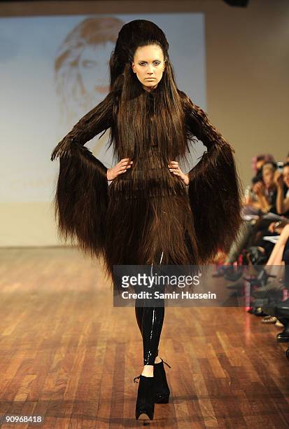 Model walks the catwalk during the Charlie Le Mindu Spring/Summer 2010 show as part of Blow Presents during London Fashion Week at the Royal Festival...