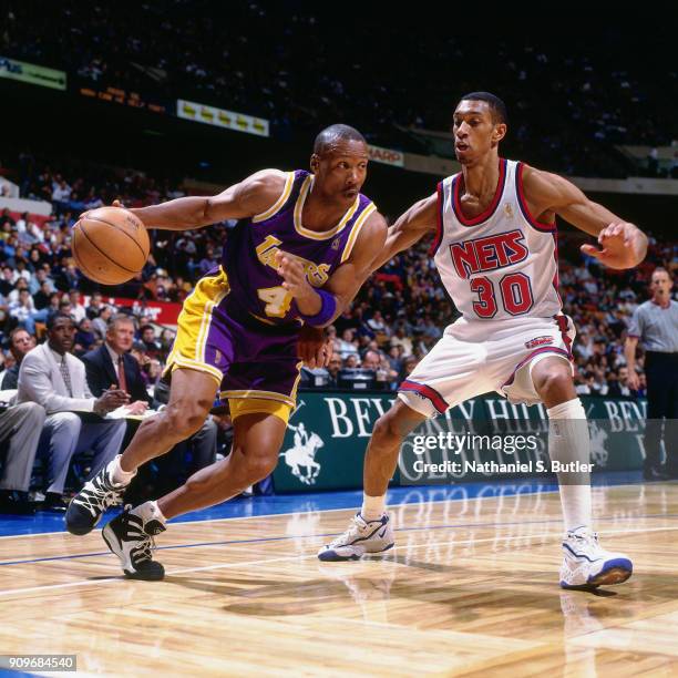 Byron Scott of the Los Angeles Lakers drives during a game played on March 24, 1997 at Continental Airlines Arena in East Rutherford, New Jersey....