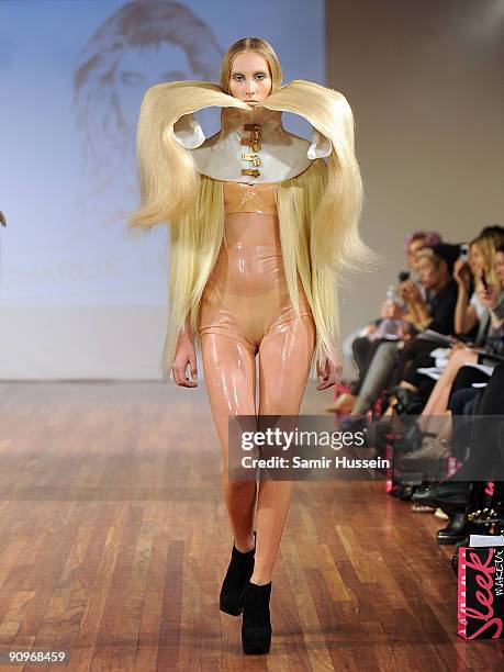 Model walks the catwalk during the Charlie Le Mindu Spring/Summer 2010 show as part of Blow Presents during London Fashion Week at the Royal Festival...