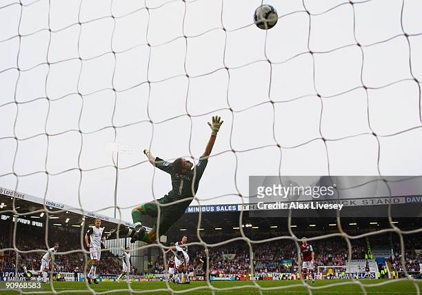 David Nugent of Burnley beats goalkeeper Craig Gordon of Sunderland to score their third goal during the Barclays Premier League match between...