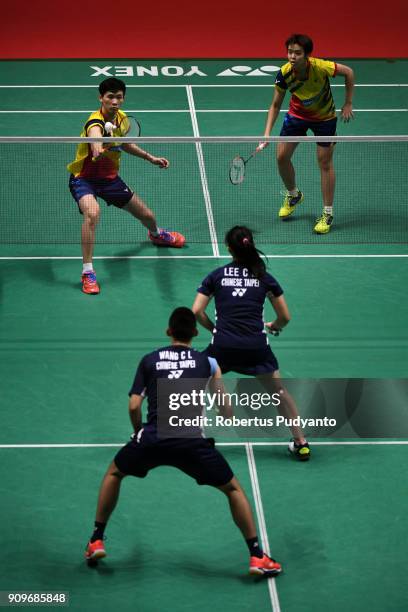 Tang Jie Chen and Yen Wei Peck of Malaysia compete against Wang Chi Lin and Lee Chia Hsin of Chinese Taipei during Mixed Doubles Round 32 match of...