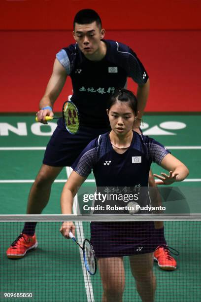 Wang Chi Lin and Lee Chia Hsin of Chinese Taipei compete against Tang Jie Chen and Yen Wei Peck of Malaysia during Mixed Doubles Round 32 match of...