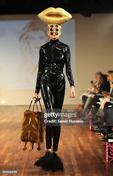 Model walks the catwalk during the Charlie Le Mindu Spring/Summer 2010 show as part of Blow Presents during London Fashion Week at the Royal Festival...