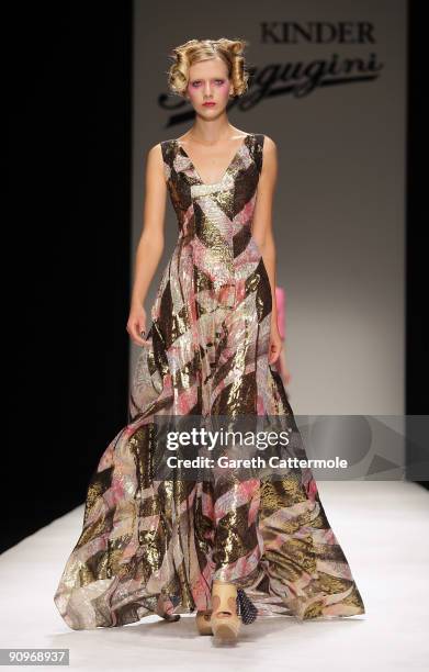 Model walks down the catwalk during the Kinder Aggugini Fashion Show as part of London Fashion Week Spring/Summer 2010 on September 18, 2009 in...