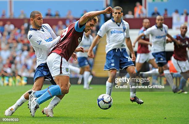 Stiliyan Petrov of Aston Villa is fouled in the area by Tel Ben Haim of Portsmouth to give away a penalty, during the Barclays Premier League match...