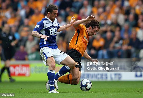 Stephen Hunt of Hull City in action with Barry Ferguson of Birmingham City during the Barclays Premier League match between Hull City and Birmingham...