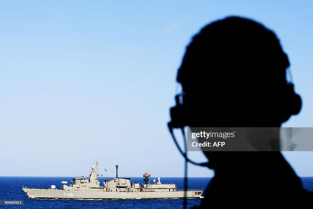 A crew member from the Dutch frigate Hr.