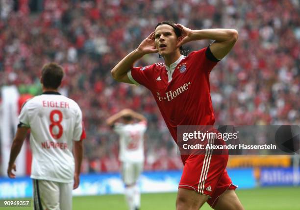 Daniel van Buyten of Muenchen celebrates scoring the second team goal during the Bundesliga match between FC Bayern Muenchen and 1. FC Nuernberg at...