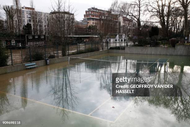 Picture shows a flooded tennis court next to the overflowed River Seine on the Ile de la Grande Jatte between Neuilly-sur-Seine and Levallois-Perret,...