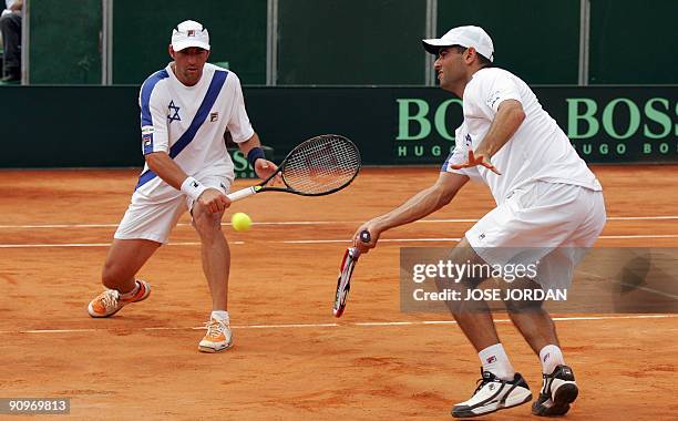 Andy Ram and Jonathan Erlich from Israel return the ball to Feliciano Lopez and Tommy Robredo from Spain during the semifinal Davis Cup match between...