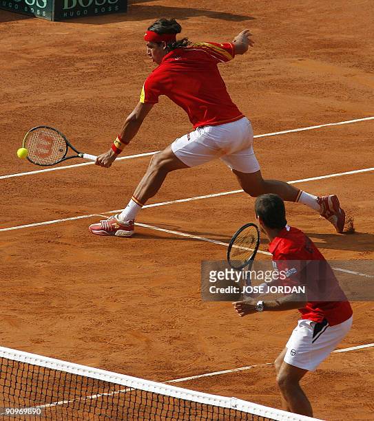 Spain's Feliciano Lopez and Tommy Robredo return the ball to Andy Ram and Jonathan Erlich from Israel during the semifinal Davis Cup match between...