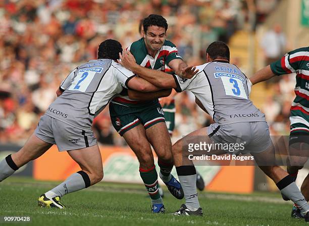 Jeremy Staunton of Leicester is tackled by Rob Vickers and Carl Hayman during the Guinness Premiership match between Leicester Tigers and Newcastle...