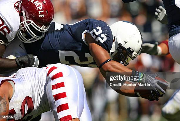 Running back Evan Royster of the Penn State Nittany Lions dives into the end zone for a touchdown during a game against the Temple Owls on September...