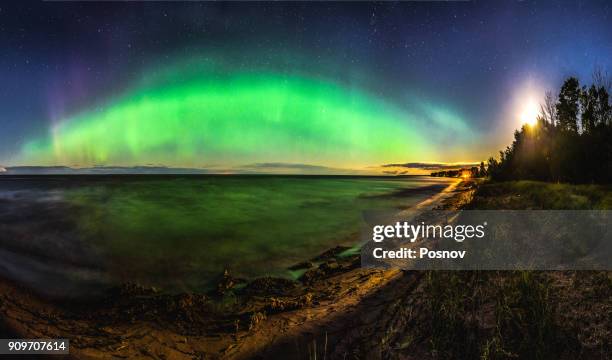 northern lights and moon rise over ontonagon beach - northern lights michigan stockfoto's en -beelden