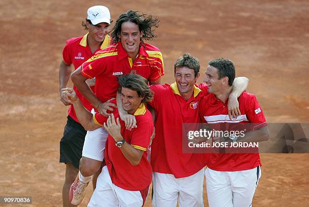 Spain's Rafael Nadal, Feliciano Lopez, David Ferre, Juan Carlos Ferrero and Tommy Robredo celebrate after winning the third match of the Davis cup...