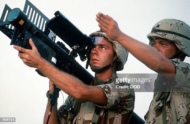 Soldier aims an FIM-92A Stinger portable missile launcher during Operation Desert Shield.